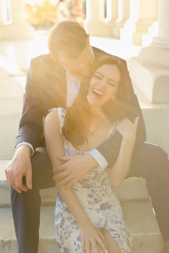Couple embraces and laughs at Cheesman Pavilion