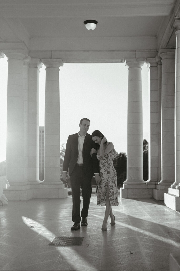 Couple walks together at Cheesman Pavilion in Denver