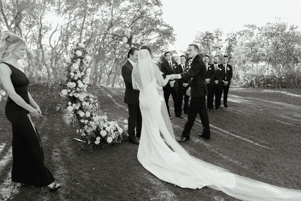 Bride and groom reach ceremony altar at the Oaks Plum Creek in Castle Rock, Colorado