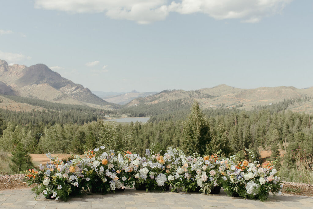 Floral ground arch by Cosette's Creations at Pikes Peak Ranch in Woodland Park, Colorado