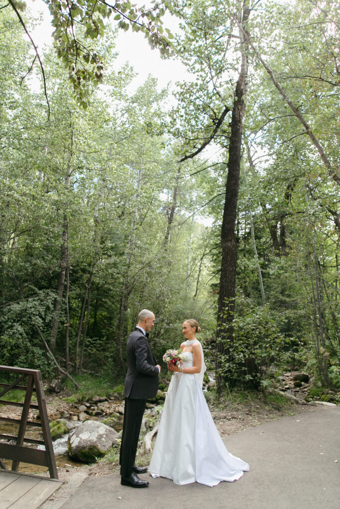 Bride and groom see each other during the first look outside the Chapel at Beaver Creek