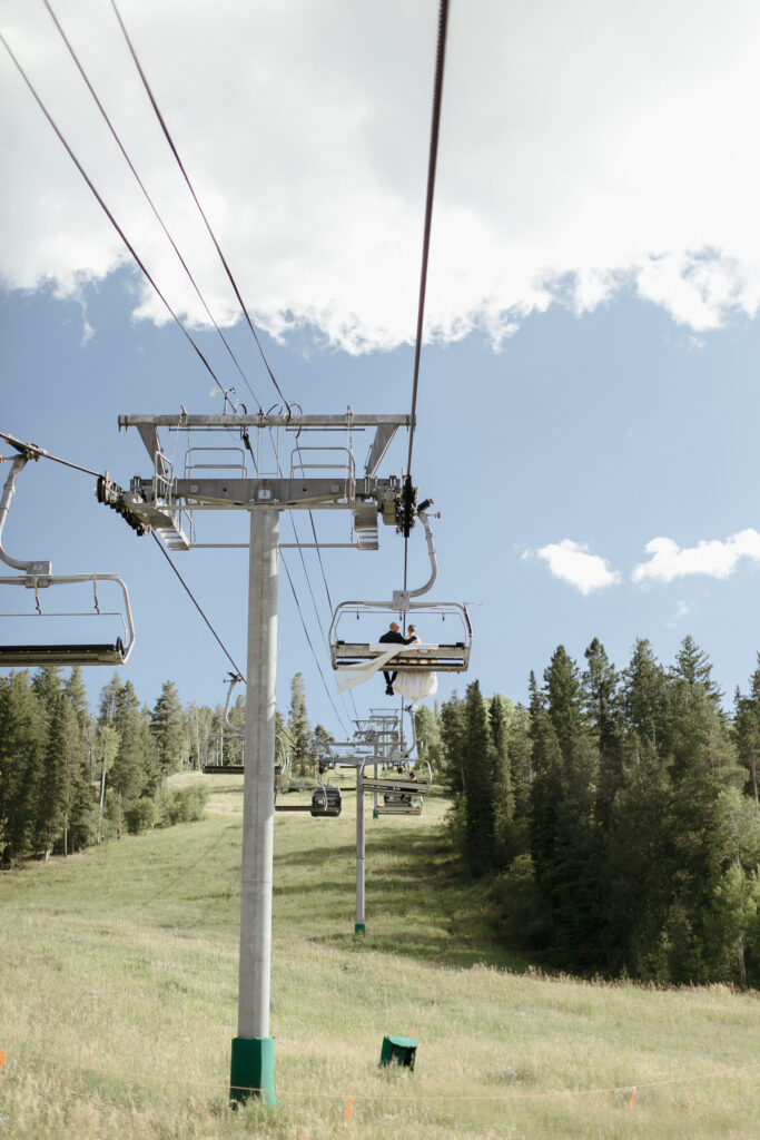 Bride and Groom sit on Centennial Express chairlift at Beaver Creek